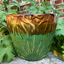 Load image into Gallery viewer, The earth and sky are represented beautifully in this vintage mid-century &quot;Celestial Moon and Star&quot; ceramic garden planter pot featuring embossed starburst suns and moons in brown and green drip glaze. Designed and crafted by Robinson Ransbottom Pottery Company, in Roseville Ohio, USA, circa 1960s. This highly collectible planter will look gorgeous filled with your favourite greenery or flowers. Perfect for the container garden enthusiast!
