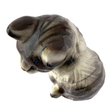 Load image into Gallery viewer, Top view of vintage ceramic grey tabby cat figurine with emerald green eyes in sitting pose, mid-century Japanese porcelain
