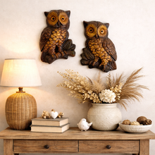Load image into Gallery viewer, Pair of 1960s Canadian chalkware owl wall plaques displayed on wall, showing hanging arrangement and relative sizing
