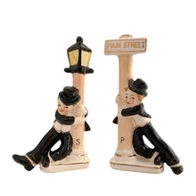 Load image into Gallery viewer, Vintage hand painted drunk Charlie Chaplin hobo hanging off a lamp post and main street sign ceramic salt and pepper shakers. Japan, 1950s. Add these unique shakers to your collection!

In excellent condition, no chips/cracks/repairs. No corks. Marked, Japan.

Measures 2 3/4 x 1 1/8 x 5 inches
