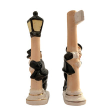 Load image into Gallery viewer, Vintage hand painted drunk Charlie Chaplin hobo hanging off a lamp post and main street sign ceramic salt and pepper shakers. Japan, 1950s. Add these unique shakers to your collection!

In excellent condition, no chips/cracks/repairs. No corks. Marked, Japan.

Measures 2 3/4 x 1 1/8 x 5 inches
