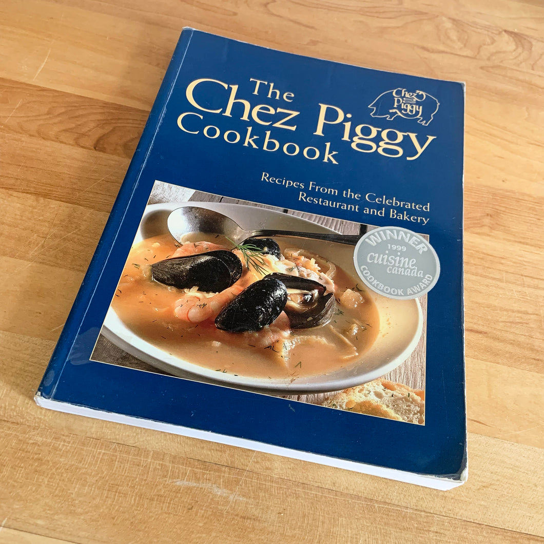 Chez Piggy is a beloved restaurant and bakery in Kingston Ontario Canada. This softcover cookbook contains 239 pages filled with wonderful recipes along with many colour photographs. Published by Firefly Books. Canada, 1988. This is the forth edition 2006.   In great vintage condition with normal age-related yellowing.   