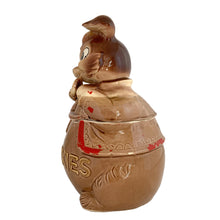 Load image into Gallery viewer, Adorable vintage, mid-century era anthropomorphic chipmunk ceramic cookie jar. Crafted by Royal Sealy, Japan, 1950s. A delightful addition to your cookie jar collection and kitchen decor!

In great vintage condition with wear to the cold paint, no chips, normal crazing commensurate with age. A crazing line extends to the unglazed portion of the lid and there is an X crazing mark on the bottom, neither goes through to the other side.

Measures 6 1/4 x 6 3/4 x 12 1/2 inches
