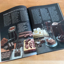 Load image into Gallery viewer, Better Homes and Gardens is known for its fabulous cookbooks. This hardcover cookbook focuses on Chocolate recipes. Its 96 pages are filled with amazing  recipes along with many colour photographs. Originally published by Meredith Corporation, USA, 1984. This is the fifth printing, 1985.   In great vintage condition with normal age-related yellowing.   
