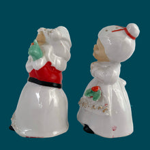 Load image into Gallery viewer, Vintage mid-century beautifully hand painted ceramic Santa and Mrs. Claus salt and pepper shakers. These Christmas themed shakers have the sweetest facial expressions, are nicely painted in red, green and black with gold spaghetti details. Crafted by Lefton, Japan, 1950s. These highly collectible kitschy shakers are the perfect accent for your Christmas holiday decor!
