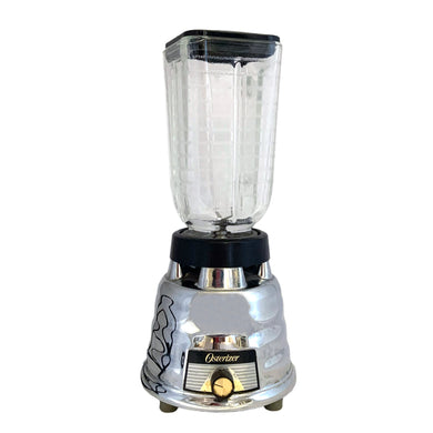 Break out the margarita mix or your favourite smoothie ingredients and whip up something delicious with this vintage shiny chrome Osterizer blender. Comes with original glass pitcher and recipe book. This one is Model 235, Series A and is one of those retro appliances that were extremely well built with a solid motor.  In good working order. Glass is sound, no chips. There is minor wear to the body commensurate with age.   