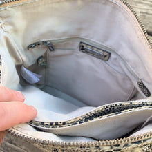 Load image into Gallery viewer, Pre-owned Ciana taupe faux python cross-body bag with adjustable strap is crafted from durable textured cow leather and features polished silver tone hardware. By Danier Leather. The zippered polyester lined interior has three compartments, one zippered pocket and metal keychain holder, one with snap closure, and one with 2-part open pocket. Exterior 2 zippered and snap closure pockets. A stylish, durable and practical accessory.
