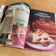 Load image into Gallery viewer, Borden is known for its fabulous dairy products. This hardcover cookbook focuses on recipes using Eagle Brand Sweetened Condensed Milk. Its 216 pages are filled with amazing  recipes along with many colour photographs. Published for Borden Inc., by Publications International USA, 1989.   In great vintage condition with normal age-related yellowing.   
