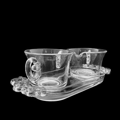 Beautifully designed vintage clear pressed glass creamer, sugar and tray set. Crafted by Josef Inwald, Czechoslovakia, circa 1930s. The perfect addition to your tableware!  In excellent condition, free from chips.  Tray measures 9 x 3 1/2 x 1 inches  Creamer and sugar measure 3 3/8 x 2 1/2 inches