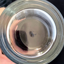 Load image into Gallery viewer, Close-up base view of a single vintage Libbey clear glass hoops tumbler showing the maker's mark
