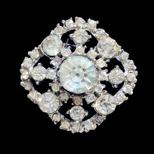 Load image into Gallery viewer, Vintage clear rhinestone starburst brooch, silver-tone openwork frame, front view, 1950s–60s costume jewellery, diamond orientation
