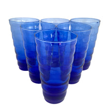 Load image into Gallery viewer, Six cobalt blue Anchor Hocking Cameron beehive tumblers arranged in a pyramid, shot from slightly above
