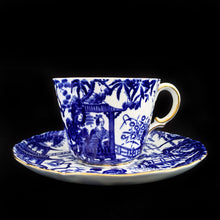 Load image into Gallery viewer, Classic &quot;Mikado&quot; flat cup and saucer with asian themed design in cobalt blue on white bone china with gold gilt rim. Craft by Royal Crown Derby, England, circa 1940s.  In excellent condition, free from chips/cracks.  Teacup measures 3 x 2 3/8 inches | Saucer measures 5 1/2 inches
