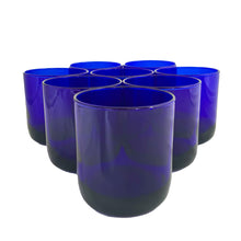 Load image into Gallery viewer, Set of eight vintage cobalt blue Premiere rocks glasses. Crafted by Libbey Glass, USA, circa 1990s. A striking addition to your everyday drinkware or barware collection.

In excellent condition, free from chips. Marked the Libbey L on the bottom.

Measures 3 x 3 3/8 inches

Capacity 10 ounces
