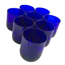 Load image into Gallery viewer, Set of eight vintage cobalt blue Premiere rocks glasses. Crafted by Libbey Glass, USA, circa 1990s. A striking addition to your everyday drinkware or barware collection.

In excellent condition, free from chips. Marked the Libbey L on the bottom.

Measures 3 x 3 3/8 inches

Capacity 10 ounces
