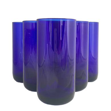 Highly sought after, set of six vintage cobalt blue Premiere cooler glasses, featuring a rounded base. Crafted by Libbey Glass, 1990s. Perfect for a tall glass of your favourite beverage and a great addition to your everyday drinkware or barware collection!

In excellent condition, no chips.

Measures 2 3/4 x 5 3/4 inches

Capacity 16 ounces