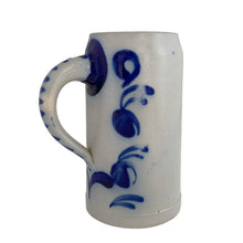Load image into Gallery viewer, Opposite side view of a vintage German stoneware beer stein from the handle side, showing cobalt blue floral motif, with dotted stripe handle detail
