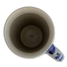 Load image into Gallery viewer, Overhead view of a vintage German salt-glazed stoneware beer stein showing the rim and unglazed off-white interior with natural kiln marks and wheel-thrown texture
