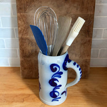 Load image into Gallery viewer, Vintage German stoneware beer stein repurposed as a kitchen utensil holder on a countertop
