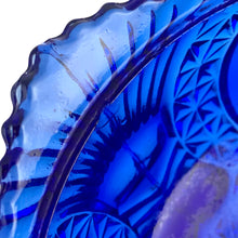 Load image into Gallery viewer, Large vintage cobalt blue love birds 3-footed, lidded candy dish, Byrdes reproduction. A licensed reproduction of the Hofbauer Byrdes model, 1990s. A gorgeous vessel to stash candy, keys, cotton balls and more!!!

In vintage condition with minor smooth chip to the outer rim and minor flea bites to both pieces which do not detract from the beauty of this piece thanks to the deep colour of the glass which tends to hide small issues.

Measures 7 1/2 x 7 1/2 inches
