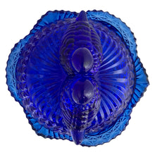 Load image into Gallery viewer, Large vintage cobalt blue love birds 3-footed, lidded candy dish, Byrdes reproduction. A licensed reproduction of the Hofbauer Byrdes model, 1990s. A gorgeous vessel to stash candy, keys, cotton balls and more!!!

In vintage condition with minor smooth chip to the outer rim and minor flea bites to both pieces which do not detract from the beauty of this piece thanks to the deep colour of the glass which tends to hide small issues.

Measures 7 1/2 x 7 1/2 inches
