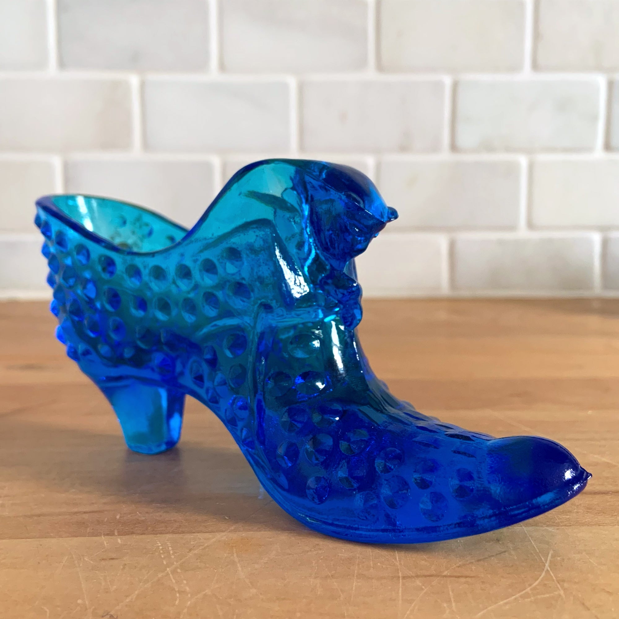 Old glass shoes top