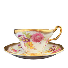 Load image into Gallery viewer, A gorgeous white bone china teacup and saucer featuring colourful pink roses, florals and a gold gilt trim. Crafted by EB Foley, England, 1948 – 1963.

In excellent vintage condition, no chips, cracks or repairs.

Teacup measures 3 3/4 x 2 1/4 inches

Saucer measures 5 5/8 inches
