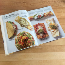 Load image into Gallery viewer, Better Homes and Gardens is known for its fabulous cookbooks. This hardcover cookbook focuses on Cooking Mexican recipes. Its 96 pages are filled with amazing  recipes along with many colour photographs. Originally published by Meredith Corporation, USA, 1986. This is the second printing, 1986.   In great vintage condition with normal age-related yellowing.
