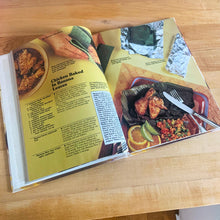 Load image into Gallery viewer, Better Homes and Gardens is known for its fabulous cookbooks. This hardcover cookbook focuses on Cooking Mexican recipes. Its 96 pages are filled with amazing  recipes along with many colour photographs. Originally published by Meredith Corporation, USA, 1986. This is the second printing, 1986.   In great vintage condition with normal age-related yellowing.
