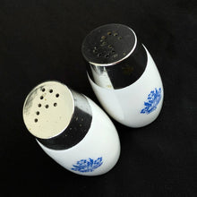 Load image into Gallery viewer, A classic set of vintage white milk glass salt and pepper shakers decorated with blue cornflowers with chrome lids with holes in the shape of an &quot;S&quot; and &quot;P&quot;. Produced by Van Pak in Canada, circa 1970  In excellent condition with only minor wear to the lids, the glass is free from chips/cracks.  Measures 1-3/4&quot; x 3-1/5&quot;
