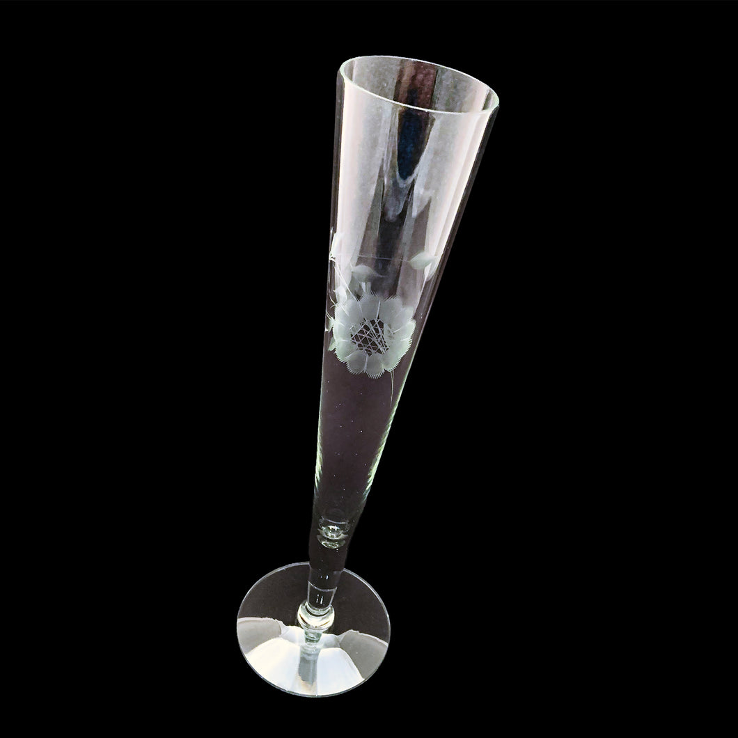 Vintage tall clear glass footed bud vase with round base (2 3/4 inches in diameter). The vase is cut with one 12-petal 