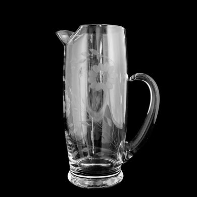 Elegant vintage WJ Hughes cut Corn Flower clear glass cocktail pitcher with 3 sets of 12-petalled corn flowers and leaf sprays, applied blown glass open handle on a West Virginia Specialty Blank, 1960s/70s. This elegant pitcher will elevate any bar or tablescape, fill with your favourite beverage and enjoy!

In excellent condition, free from chips/cracks.

Measures 5 3/4 x 4 x 9 3/4 inches tall

Capacity 56 ounces