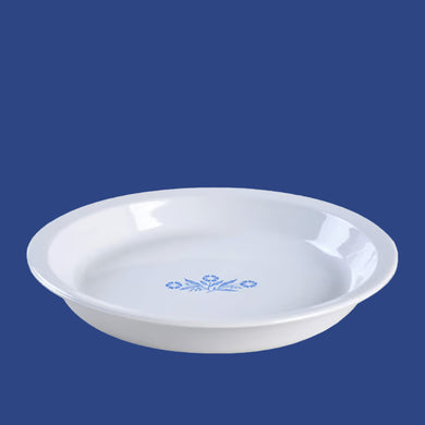 Vintage Cornflower Blue pie serving plate. Manufactured by Corning, Canada, 1957 - 1988. A must for any pie baker!

In excellent condition, no chips/wear. Doesn't appear to have been used.

Measures 9 7/8 x 1 1/2 inches