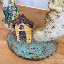 Load image into Gallery viewer, Rare early 20th century vintage The Cow Jumped Over the Moon nursery rhyme hand painted cast iron doorstop. Signed by the artist Arni on the base. This solid, one-piece diecast cut doorstop is an original free of mold seams, screws or grind marks and weighs 4 1/4 pounds. A wonderful piece of folk art to add charm to your home&#39;s decor.

In as found vintage condition with wear to the paint and rusty patina.

Measures 7 x 8 1/2 inches
