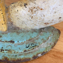 Load image into Gallery viewer, Rare early 20th century vintage The Cow Jumped Over the Moon nursery rhyme hand painted cast iron doorstop. Signed by the artist Arni on the base. This solid, one-piece diecast cut doorstop is an original free of mold seams, screws or grind marks and weighs 4 1/4 pounds. A wonderful piece of folk art to add charm to your home&#39;s decor.

In as found vintage condition with wear to the paint and rusty patina.

Measures 7 x 8 1/2 inches
