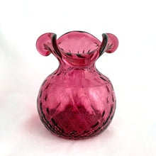 Load image into Gallery viewer, This lovely hand blown vintage cranberry optic glass vase with tri-fold edge, features a striking quilted diamond pattern which extends to the bottom of the vessel. Expertly crafted by Rossi Art Glass, Canada, circa 1980s. Perfect for displaying a small floral bouquet. A wonderful way to liven up your home&#39;s decor!  In excellent condition, free from chips.  Measures 3 3/4 x 5 inches   
