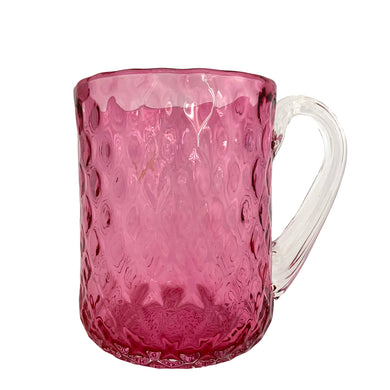 Stunning vintage hand blown cranberry optic glass mug, features a quilted diamond pattern with applied clear ribbed glass handle. Expertly crafted by Rossi Art Glass, Canada, circa 1980s. Perfect for way to elevate your hot beverage! In excellent condition, free from chips. Measures 3 1/2 x 4 3/4 inches