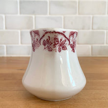 Load image into Gallery viewer, Vintage cranberry red floral transferware white ceramic handled creamer. Crafted by McNicol China, USA. The charming sidekick to your morning coffee or tea!

In excellent condition, no chips/cracks.

Measures 2 3/4 x 2 3/4 inches
