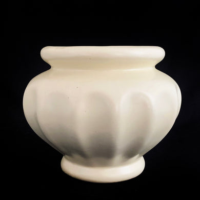 We can't resist this type of ceramic planter vase simply because of the creaminess of the off-white glaze on this round Grecian style urn planter. Produced by Haeger U.S.A., circa 1970. Fill this beauty with houseplants, succulents or a beautiful bouquet of flowers. Whatever you choose it'll make a fabulous addition to your decor!  In vintage condition, with a chip to the rim, no cracks. Unmarked.  Measures 5 1/2 x 4 3/4 inches