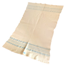 Load image into Gallery viewer, Stay toasty warm with this vintage cream wool crib or lap blanket or throw featuring blue stripes and a blanket stitched edge. Crafted by Heather Bell, 1950s. A wonderful way to stay warm and toasty!&nbsp;

One has the original tag and both are in as found vintage condition, with minor wear. Easily repurpose crafting.

Measures 42 x 61 inches
