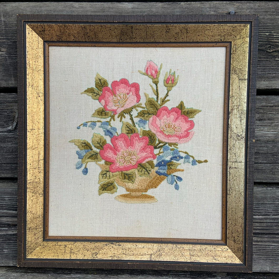 This beautifully embroidered still life of a floral bouquet of pinks, blues and greens on ecru linen was lovingly stitched by the owners mother, Margaret White who gave it to her daughter as a Christmas gift in 1975 (provenance is hand written on the back of the piece.  In excellent condition.  Approximately 13 5/8 x 14 5/8 inches   