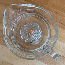Load image into Gallery viewer, We are loving this vintage clear depression glass &quot;Criss Cross&quot; citrus juice reamer. Every home should have one of these practical kitchen helpers that makes squeezing oranges, lemons and limes a breeze! This one has a convenient spout and smooth finger handle design. Produced by Hazel-Atlas Glass, USA, circa 1930s. Perfect for the fresh squeezed juice enthusiast...no sugar added! In excellent condition, free from chips/wear. Measures 5 3/4 x 3 1/2 inches

