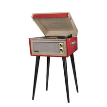 Load image into Gallery viewer, Vintage retro mid-century modern style Dansette Bermuda Record Player Turntable by Crosley in coral pink with black legs. Crank up the nostalgia and spin some vinyl or use as a funky prop for photos or TV and movie production!

In working order, but the sound output needs attention, or, use the RCA outputs on the back of the unit to hook up external self-powered speakers. Alternatively, it may just need a new needle.

Overall dimensions 15 1/4 x 16 1/2 x 26 1/4 inches (incl. legs with cover closed)
