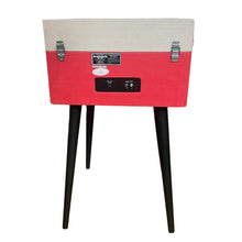 Load image into Gallery viewer, Vintage retro mid-century modern style Dansette Bermuda Record Player Turntable by Crosley in coral pink with black legs. Crank up the nostalgia and spin some vinyl or use as a funky prop for photos or TV and movie production!

In working order, but the sound output needs attention, or, use the RCA outputs on the back of the unit to hook up external self-powered speakers. Alternatively, it may just need a new needle.

Overall dimensions 15 1/4 x 16 1/2 x 26 1/4 inches (incl. legs with cover closed)
