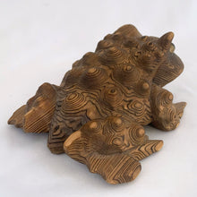 Load image into Gallery viewer, Vintage Cryptomeria carved wood frog figurine. Crafted in Japan, 1970s. This style of carving was very popular and makes a nice decor piece for the nature lover.

In excellent condition. Marked Japan.

Measures 6 x 4 1/2 x 2 1/2 inches

