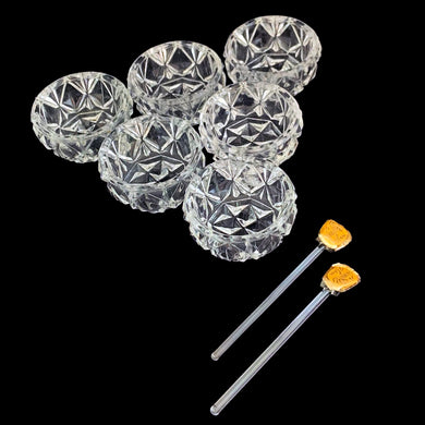 Vintage set of six crystal salt cellars and two spoons. Crafted by Bohemia Crystal, circa 1950s. A lovely addition to your tablescape. In as found vintage condition in original box. Each spoon is wrapped and has the original yellow sticker which reads Bohemia Crystal, Made in Czechoslovakia. Salt cellars measure 1 5/8 x 7/8 inches. Spoons measure 2 3/4 inches