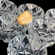 Load image into Gallery viewer, Vintage set of six crystal salt cellars and two spoons. Crafted by Bohemia Crystal, circa 1950s. A lovely addition to your tablescape. In as found vintage condition in original box. Each spoon is wrapped and has the original yellow sticker which reads Bohemia Crystal, Made in Czechoslovakia. Salt cellars measure 1 5/8 x 7/8 inches. Spoons measure 2 3/4 inches
