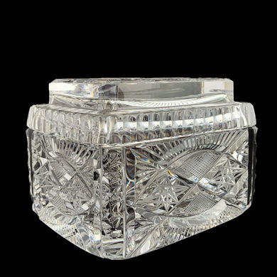 Elegant vintage cut crystal lidded cigarette box. Crafted by Bohemia Crystal, Czechoslovakia, 1970s. This box provides a decorative way to store cigarettes with the lid functioning as an ashtray. Not a smoker? Use this versatile elegant box to store playing cards, candies or trinkets. Add this statement piece to your home decor or give as a gift.

In excellent condition, no chips.

Measures 4 1/2 x 3 3/8 x 3 1/2 inches