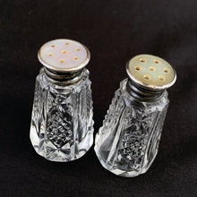 Load image into Gallery viewer, Enhance your tablescape with these sparkling vintage fine cut crystal tower-shaped salt and peppers shakers topped with silver lids inlaid with mother-of-pearl....stunning!  The crystal is in excellent condition. The sterling silver lids are worn, but could shine up nicely if polished.  Measures 1 1/8 x 2 inches   
