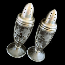 Load image into Gallery viewer, Beautiful pair of antique clear pressed glass salt and pepper shakers featuring a cut pattern of florals and vertical bands topped with silver plated lids. Possibly Fry Glass, Roden Silver for Birks Canada, early 20th century.  In excellent vintage condition, no chips to the glass. Lids are marked, see photo.  Measures 1 5/8 x 4 1/2 inches
